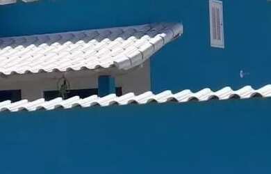 Imagem: A casa possui 2 Dormitórios, Acomodam 10 pessoas, 3 Vagas na