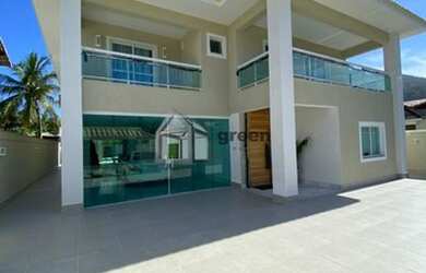 Imagem: A casa em condomínio possui 4 Dormitórios, 5 Banheiros, 530m²