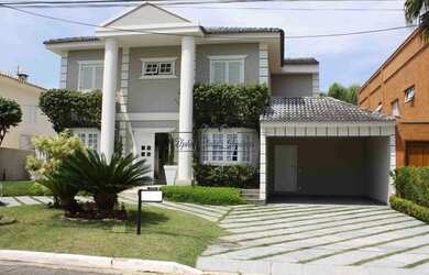 Imagem: A casa possui 4 Dormitórios, 5 Banheiros, 2 Vagas na garagem