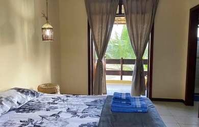 Imagem: A casa possui 3 Dormitórios, 2 Vagas na garagem e está localizado