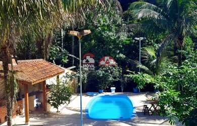 Imagem: A casa possui 3 Dormitórios, 2 Banheiros, 3 Vagas na garagem