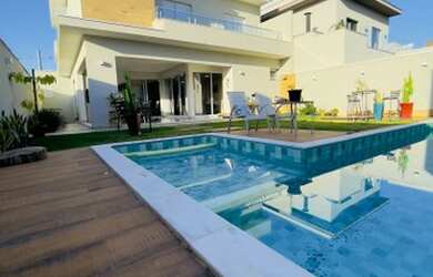 Imagem: A casa em condomínio possui 3 Dormitórios, 5 Banheiros, 2