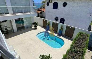 Imagem: A casa possui 5 Dormitórios, 5 Banheiros, 5 Vagas na garagem