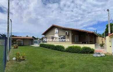 Imagem: A casa possui 3 Dormitórios, 4 Banheiros, 5 Vagas na garagem