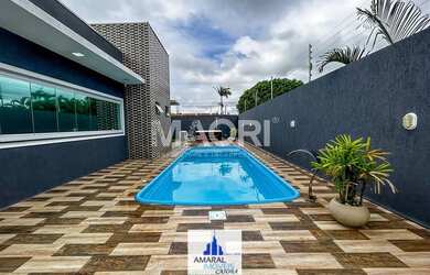 Imagem: A casa possui 3 Dormitórios, 2 Banheiros, 3 Vagas na garagem