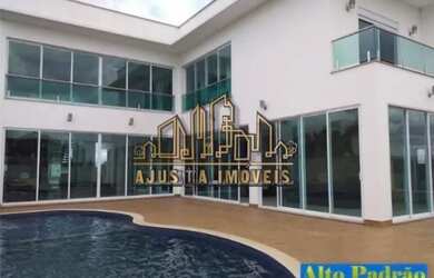 Imagem: A casa possui 4 Dormitórios, 5 Banheiros, 5 Vagas na garagem