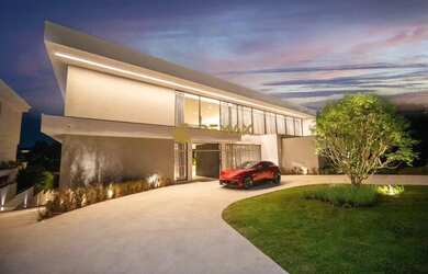 Imagem: A casa possui 5 Dormitórios, 5 Banheiros, 5 Vagas na garagem