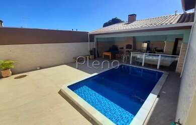 Imagem: A casa possui 4 Dormitórios, 2 Banheiros, 3 Vagas na garagem