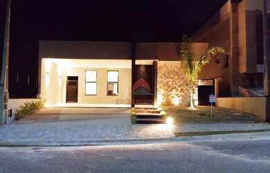 Imagem: A casa possui 3 Dormitórios, 5 Banheiros, 4 Vagas na garagem