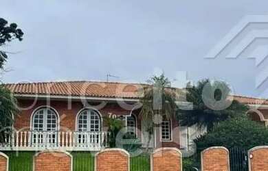 Imagem: A casa possui 4 Dormitórios, 5 Banheiros, 5 Vagas na garagem