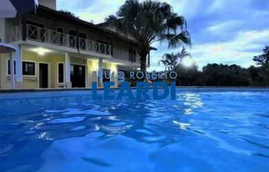 Imagem: A casa possui 5 Dormitórios, 4 Banheiros, 5 Vagas na garagem