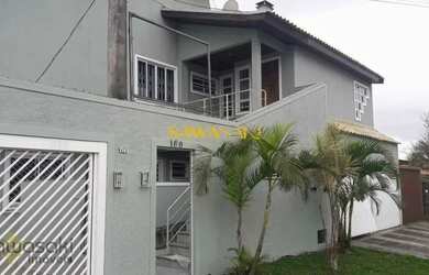 Imagem: A casa possui 5 Dormitórios, 3 Banheiros, 4 Vagas na garagem