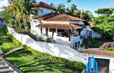 Imagem: A casa possui 4 Dormitórios, 4 Banheiros, 4 Vagas na garagem