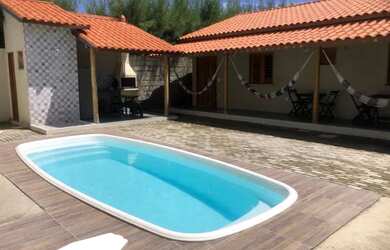 Imagem: A casa possui 2 Dormitórios, 3 Banheiros, 3 Vagas na garagem