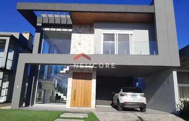 Imagem: A casa em condomínio possui 4 Dormitórios, 5 Banheiros, 2