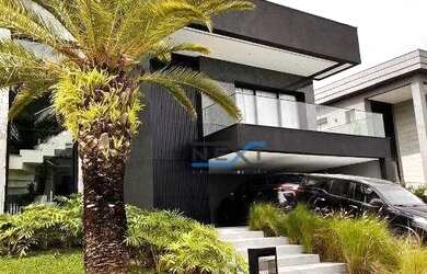 Imagem: A casa em condomínio possui 5 Dormitórios, 5 Banheiros, 4