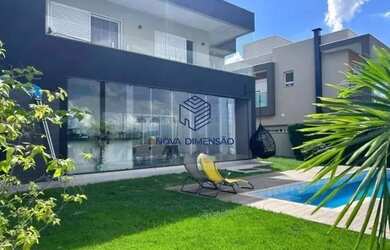 Imagem: A casa possui 4 Dormitórios, 5 Banheiros, 4 Vagas na garagem