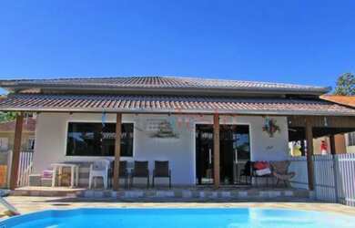 Imagem: A casa possui 4 Dormitórios, 4 Vagas na garagem e está localizado