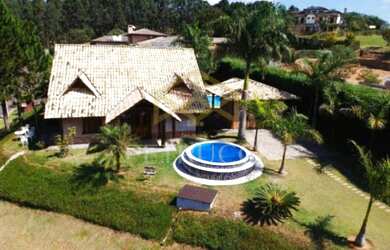 Imagem: A casa em condomínio possui 4 Dormitórios, 4 Banheiros, 5