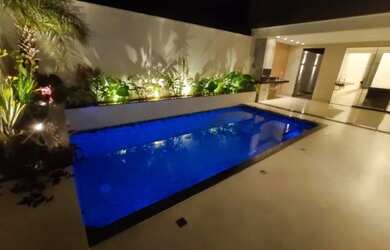 Imagem: A casa possui 3 Dormitórios, 4 Banheiros, 4 Vagas na garagem