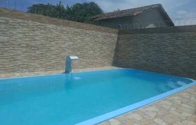 Imagem: A casa possui 3 Dormitórios, 2 Banheiros, 3 Vagas na garagem