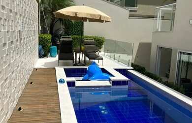 Imagem: A casa em condomínio possui 4 Dormitórios, 5 Banheiros, 2