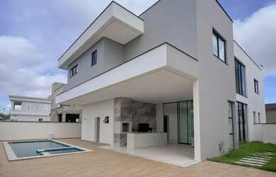 Imagem: A casa em condomínio possui 5 Dormitórios, 5 Banheiros, 4