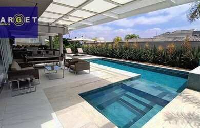 Imagem: A casa em condomínio possui 4 Dormitórios, 5 Banheiros, 5