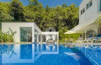 Imagem: A casa possui 5 Dormitórios, 5 Banheiros, 4 Vagas na garagem