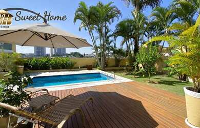 Imagem: A casa possui 4 Dormitórios, 5 Banheiros, 4 Vagas na garagem