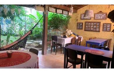 Imagem: A casa possui 4 Dormitórios, 3 Banheiros, 2 Vagas na garagem