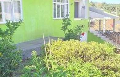 Imagem: A casa possui 4 Dormitórios, 1 Banheiro, 1 Vaga na garagem