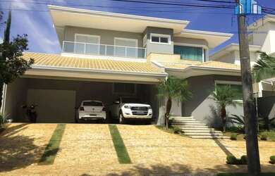 Imagem: A casa possui 4 Dormitórios, 5 Banheiros, 5 Vagas na garagem