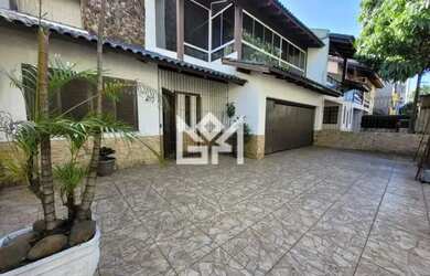 Imagem: A casa possui 3 Dormitórios, 4 Banheiros, 4 Vagas na garagem