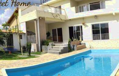 Imagem: A casa possui 5 Dormitórios, 5 Banheiros, 5 Vagas na garagem