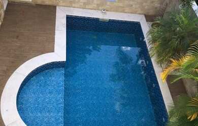 Imagem: A casa possui 3 Dormitórios, 4 Banheiros, 5 Vagas na garagem