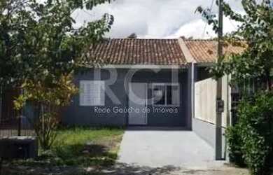 Imagem: A casa possui 2 Dormitórios, 1 Banheiro, 2 Vagas na garagem