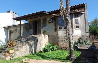 Imagem: A casa possui 2 Dormitórios, 1 Banheiro, 1 Vaga na garagem