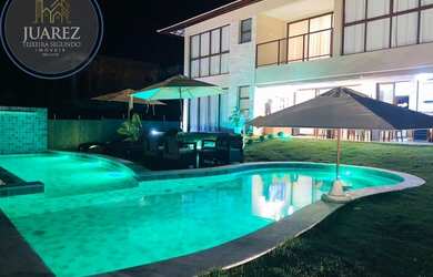 Imagem: A casa possui 5 Dormitórios, 5 Banheiros, 4 Vagas na garagem