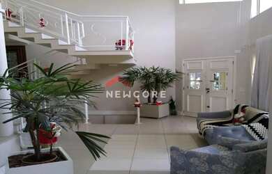 Imagem: A casa possui 3 Dormitórios, 3 Banheiros, 3 Vagas na garagem