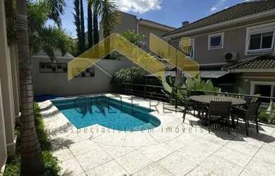 Imagem: A casa possui 4 Dormitórios, 5 Banheiros, 5 Vagas na garagem