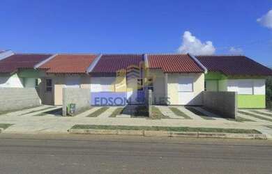 Imagem: A casa possui 2 Dormitórios, 1 Banheiro, 1 Vaga na garagem