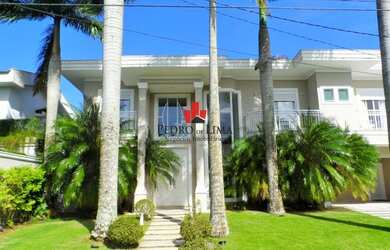 Imagem: A casa possui 5 Dormitórios, 5 Banheiros, 5 Vagas na garagem