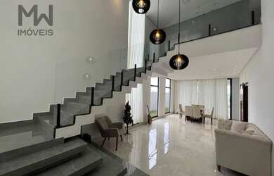 Imagem: A casa possui 4 Dormitórios, 5 Banheiros, 2 Vagas na garagem