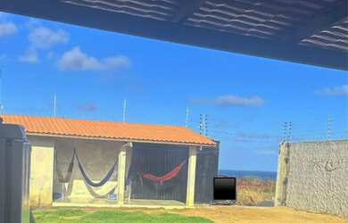 Imagem: A casa possui 2 Dormitórios, Acomodam 10 pessoas, 5 Vagas na