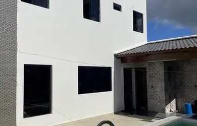 Imagem: A casa possui 3 Dormitórios, 5 Banheiros, 2 Vagas na garagem