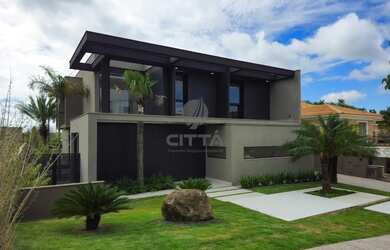 Imagem: A casa em condomínio possui 4 Dormitórios, 5 Banheiros, 5