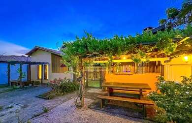 Imagem: A casa possui 3 Dormitórios, 3 Banheiros, 5 Vagas na garagem