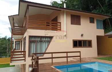 Imagem: A casa possui 5 Dormitórios, 5 Banheiros, 5 Vagas na garagem