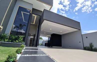 Imagem: A casa possui 4 Dormitórios, 4 Banheiros, 5 Vagas na garagem